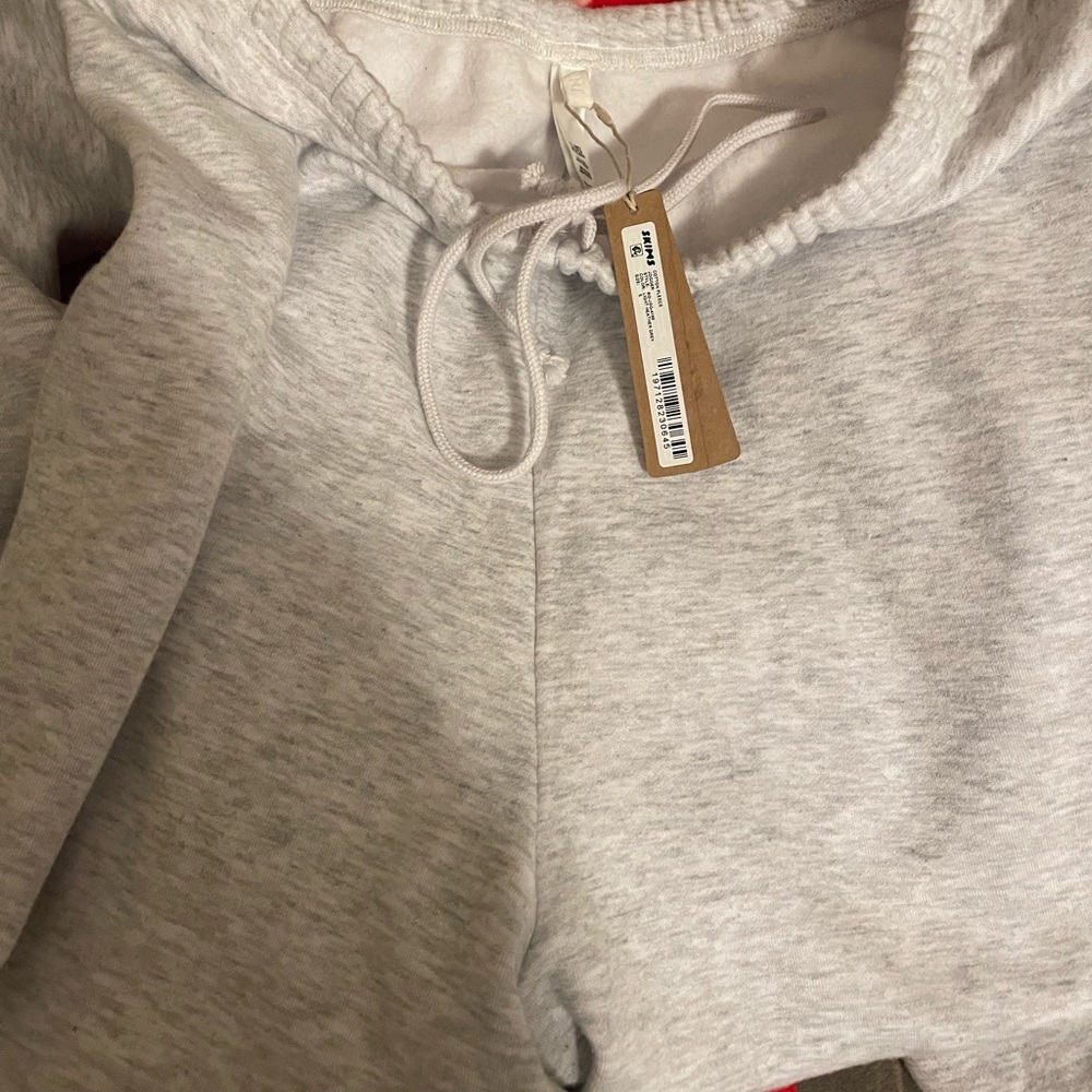 Skims grey hoodie and matching grey sweatpants. Tags still on.